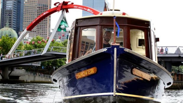 Hamish Turner at the wheel of refurbished riverboat Grower will run a city loop water-taxi service from Friday.