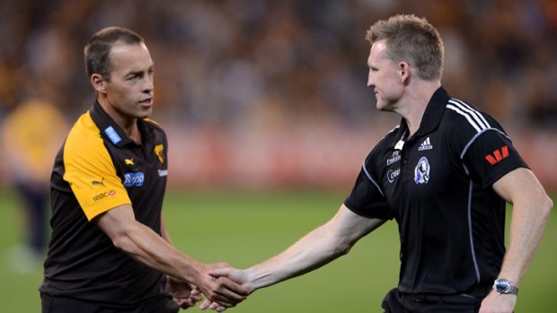 Rival coaches Alastair Clarkson (Hawthorn) and Nathan Buckley (Collingwood) shake hands before the game.