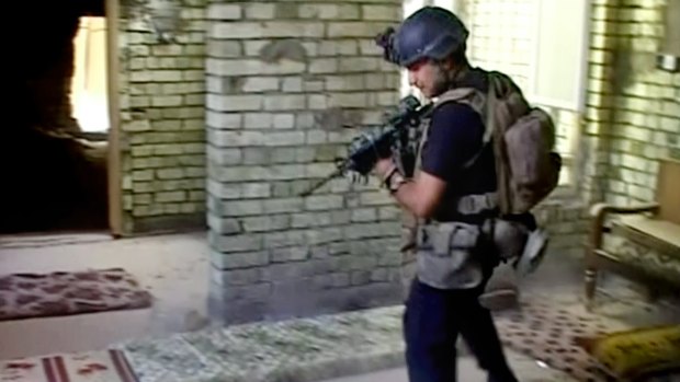 An Iraqi soldier clears a building in Fallujah.