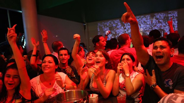 Miami basketball fans celebrate the Heat's win at one of the city's bars.