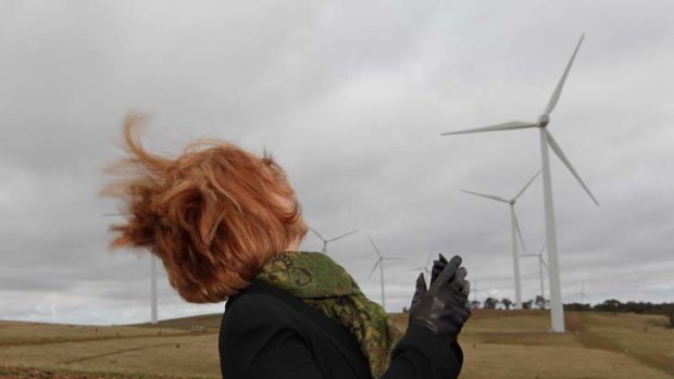 Windswept ... Prime Minister Julia Gillard at a wind farm in Gunning to promote clean energy, despite opposition from residents living near proposed developments who complain of potential noise.