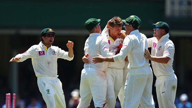 James Pattinson is congratulated by his teammates after dismissing Sachin Tendulkar.