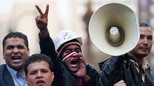Egyptian anti-government protesters shout slogans against President Hosni Mubarak