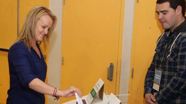 Gaffes no barrier to success ... Fiona Scott casts her vote at Glenmore Park High School.