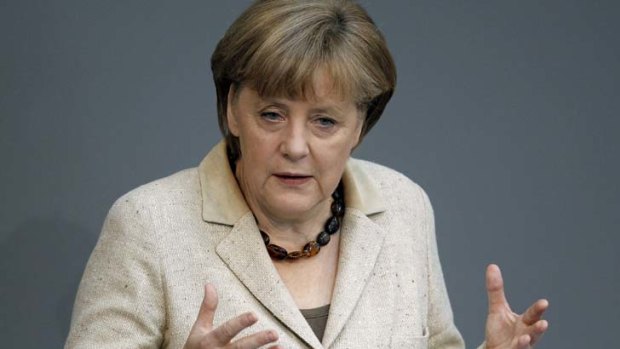 "Growth through debt would throw us back to the beginning of the crisis" ... Angela Merkel tells France and Greece not to abandon debt cuts.