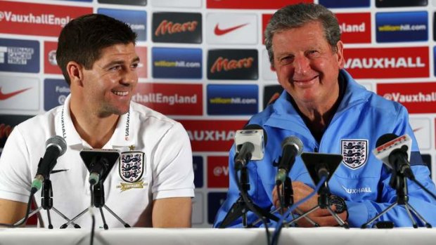 Feeling good: Steven Gerrard and Roy Hodgson address the media.