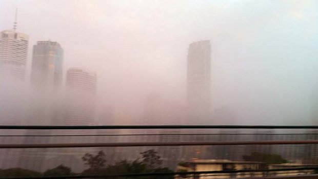 Fog cloaks the towers in Brisbane's CBD.
