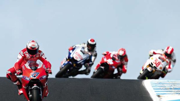Catch me if you can ... Casey Stoner winds up his Ducati as his chasers play catch-up during the Australian MotoGP at Phillip Island yesterday. Stoner went on to claim his fourth straight win in the race.
