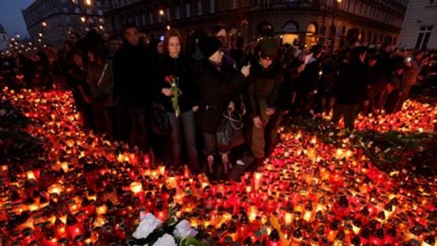 United in grief... many thousands of Polish people gathered at the Presidential Palace to grieve the death of President Lech Kaczynski.