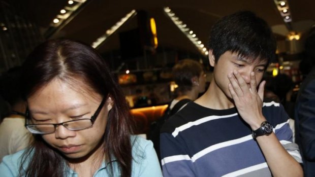 People, who said they believed their relatives were on Malaysia Airlines flight MH17.