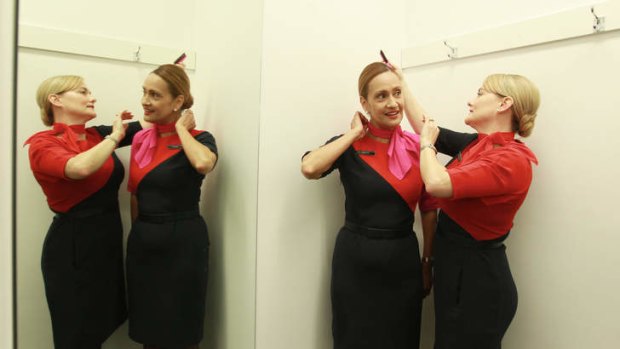 Qantas employees Sharon Ashcroft and Albertina Hill wearing their new uniforms.