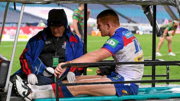 Injured: Alex McKinnon after a cannonball tackle.
