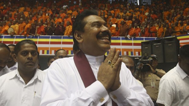 Campaign ... Mahinda Rajapaksa greets  monks in Colombo.