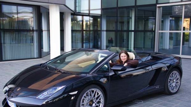 Flying start ... the writer in a convertible Lamborghini.