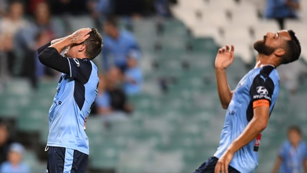 So close: Alex Brosque, right, reacts to a missed goal.