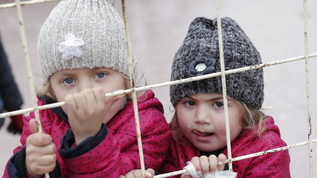 Syrian children at the Turkish border crossing with Syria. 
