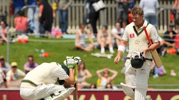 David Warner walks over to console Nathan Lyon after the latter was dismissed by Doug Bracewell to give New Zealand a seven-run victory.
