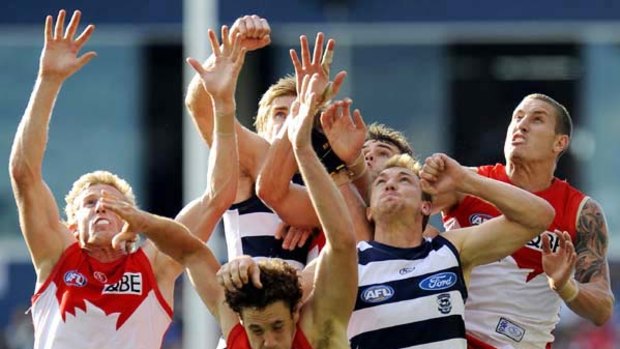 A big pack sets itself for a mark in yesterday's match between Geelong and Sydney at Skilled Stadium, won convincingly by the Cats.
