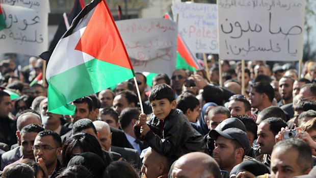 Turning point ... Palestinians in Ramallah wait to hear Mahmoud Abbas's speech to the UN.