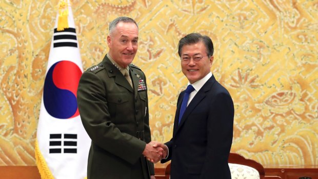 South Korean President Moon Jae-in, right, poses with US Joint Chiefs Chairman General Joseph Dunford during a meeting at the presidential Blue House in Seoul, South Korea, on Monday.