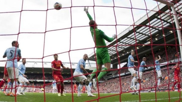 On the mark: Liverpool's Martin Skrtel, right, scores past Manchester City's goalkeeper Joe Hart.
