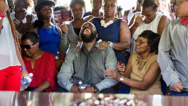 Michael Brown snr at the funeral of his son, Michael Brown, in August.