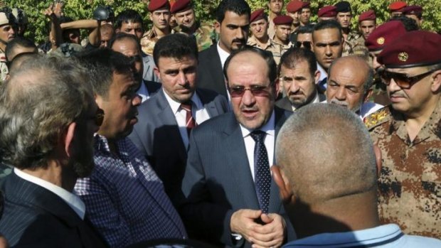 Iraqi Prime Minister Nouri al-Maliki at the funeral for Major General Negm Abdullah Ali.