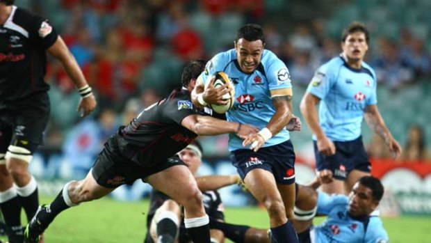 On the loose ... Waratahs fullback Sosene Anesi finds some space to move on the Sydney Football Stadium turf during last night’s much-needed win over the Sharks.