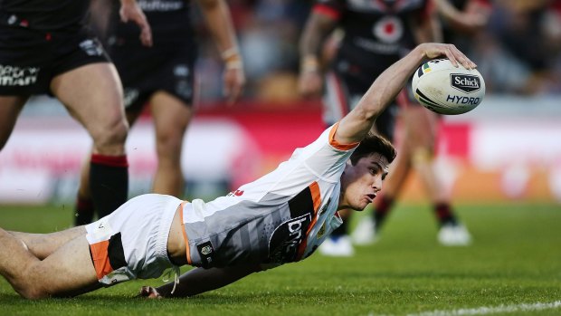 Full stretch: Mitchell Moses of the Tigers scores.