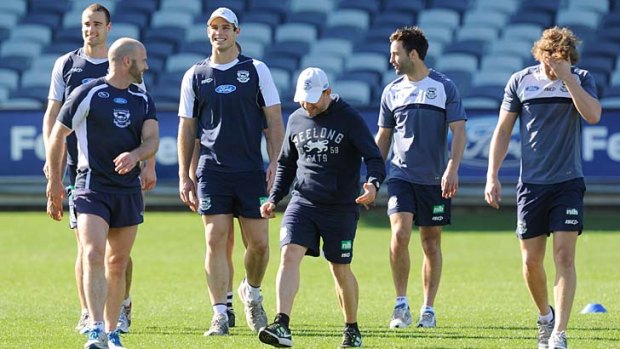 Geelong's Trent West, Paul Chapman, Tom Hawkins, and Jimmy Bartel leave the ground after training.