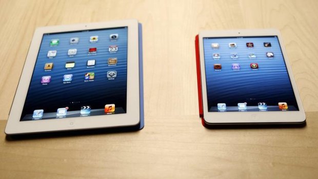 The new iPad mini is shown next to a full sized model.