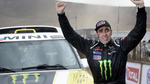Nani Roma celebrates winning the Dakar Rally 2014.