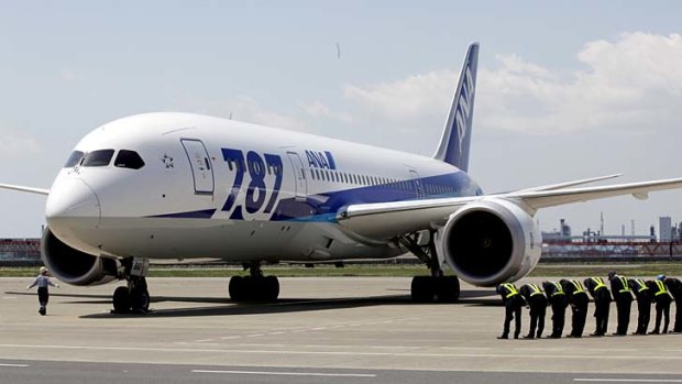 A Boeing 787 Dreamliner of All Nippon Airways lands after a test flight at Haneda International Airport on Sunday.