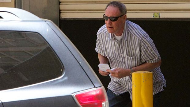 Former <i>Hey Dad!</i> actor Robert Hughes leaves Central Local Court having being granted bail.