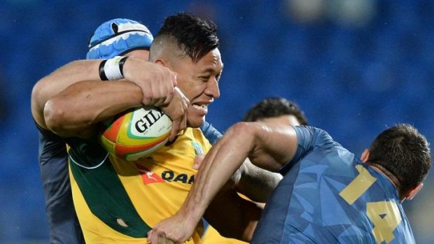 Not so crowded house: Israel Folau grimaces in front of just over 14,000 on the Gold Coast.