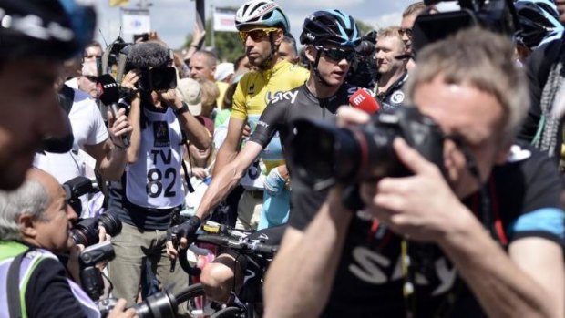 Crowded: Britain's Chris Froome and Italy's Vincenzo Nibali wait at the departure village in Cambridge prior to the start of the 155 km third stage of the Tour de France.