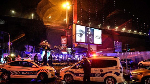 Policemen secure the area after an attack on Reina, a popular night club in Istanbul.