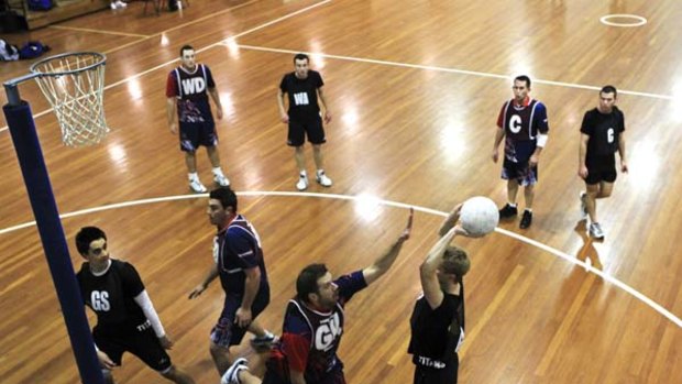 Going for goal ... men's teams play netball during a competition night at Lidcombe.