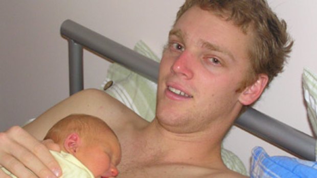 Mathew Hopkins with his newborn.
