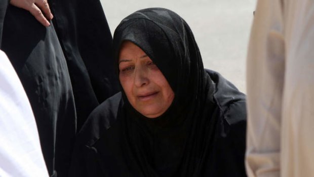 A mother mourns the death of her son, killed in a bomb attack near Baghdad.
