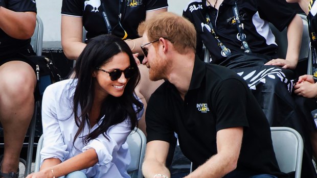 Prince Harry and his girlfriend Meghan Markle attend a wheelchair tennis event at the Invictus Games in Toronto, in September