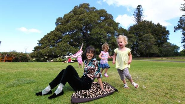 Freedom before fear ... children frolic while Lenore Skenazy kicks back in the Sydney Botanical Gardens.