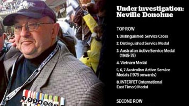 Highly decorated, highly suspect: Neville Donohue poses with an array of medals.