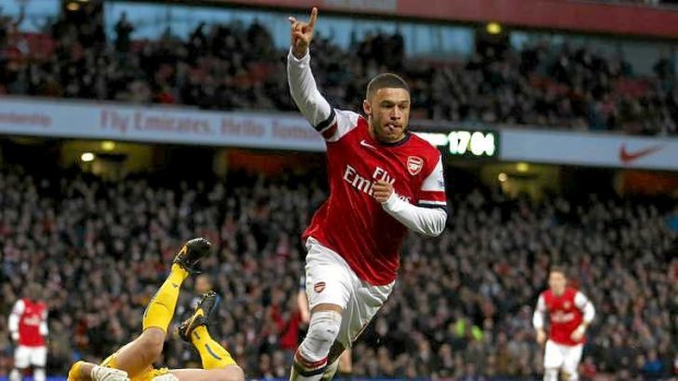 Double: Arsenal's Alex Oxlade-Chamberlain celebrates after scoring against Crystal Palace.