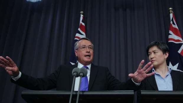 Confidence is king ... Treasurer Wayne Swan and Finance Minister Penny Wong pledge to hold the line on the budget surplus.