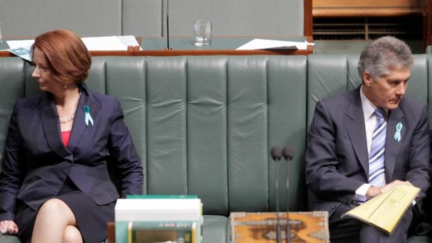 Prime Minister Julia Gillard sits next to defence minister Stephen Smith during a division in question time at Parliament House Canberra on Wednesday 29 February 2012. Photo: Andrew Meares