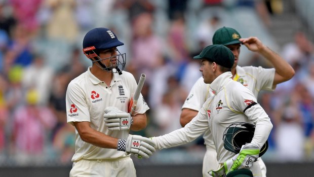 Australian wicketkeeper Tim Paine congratulates England opener Alastair Cook on Thursday.