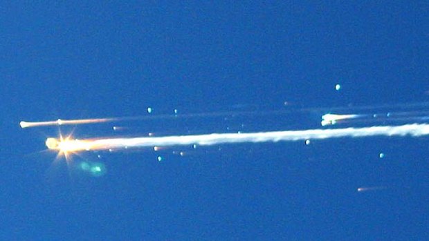Debris from the space shuttle Columbia streaks across the sky over Tyler, Texas.