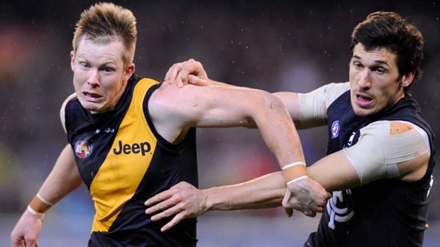 Richmond's Jack Riewoldt and Carlton's Michael Jamison fight it out during the round 18 clash between the two clubs last season.