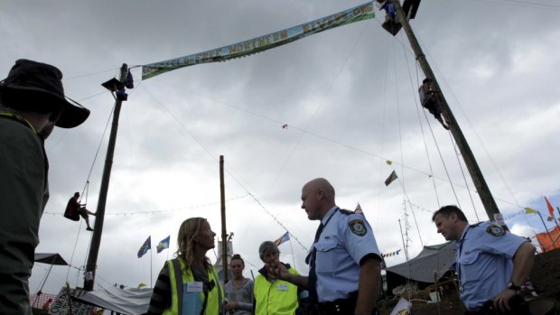Police confront protesters who had been blockading a site where gas company Metgasco planned to drill.